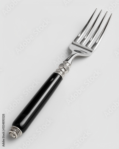 Stainless steel serving fork with polished finish and black handle on white background, elegant kitchen utensil for serving meats and salads, perfect for formal dinners and everyday family meals 