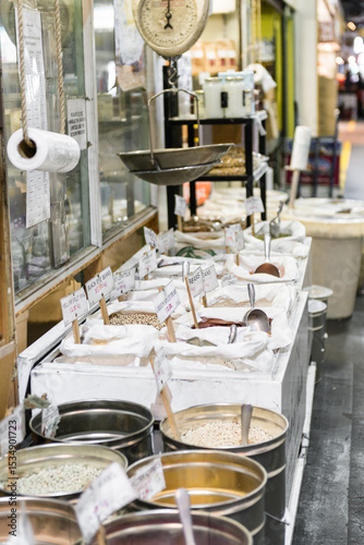 Grain and beans with old fashioned scales at a food market photo