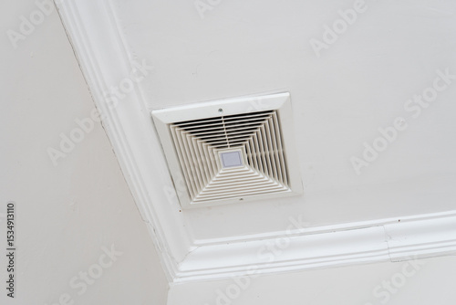 Ceiling exhaust fan photograph for HVAC maintenance stock image, interior ventilation photo for home improvement or building architecture visual