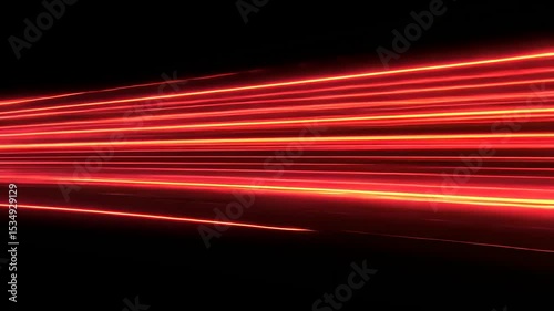 Abstract red light streaks create a dynamic visual effect against a black background, ideal for design