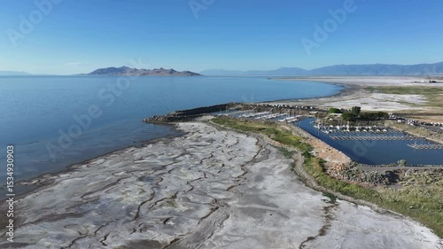 Aerial Utah State Marina Park Great Salt Lake pull 2. Largest saltwater lake in the Western Hemisphere. Solar evaporation ponds produce salt, potassium, magnesium. Recreation and industry.