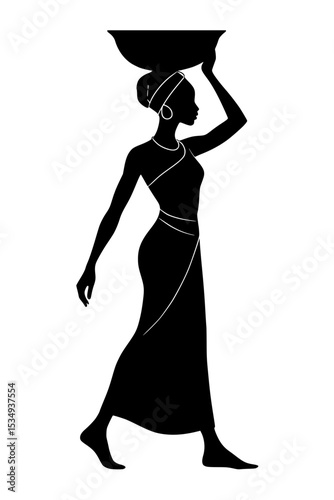 Woman carrying bowl on head while walking in silhouette style  