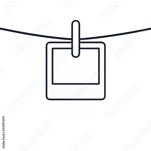 Minimalist black and white Polaroid photo on string, nostalgia concept