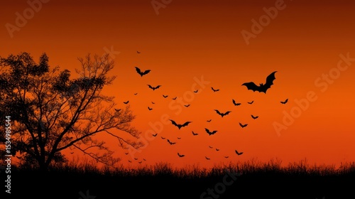 Halloween night sky with flying bats and orange gradient