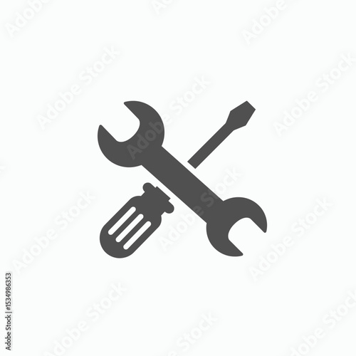 A gray wrench and screwdriver are crossed in the center of a white background
