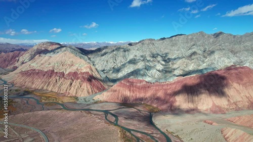 Drone view of Yadan landform near Kashgar in southern Xinjiang, China. High angle view of colorful mountains in sunny autumn day, 4k hyper time lapse landscape footage b roll shot.