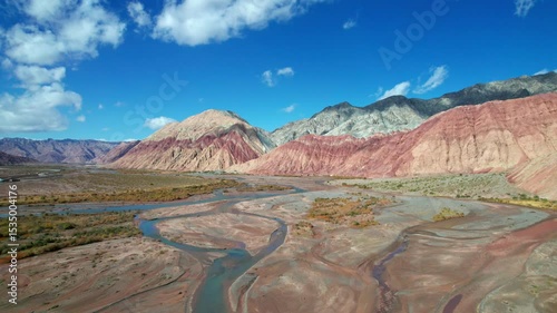 Drone view of Yadan landform near Kashgar in southern Xinjiang, China. High angle view of colorful mountains in sunny autumn day, 4k real time landscape footage b roll shot.