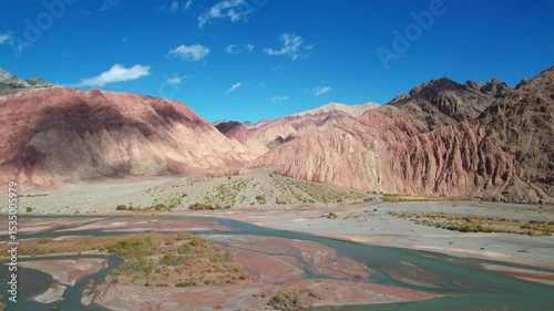 Drone view of Yadan landform near Kashgar in southern Xinjiang, China. High angle view of colorful mountains in sunny autumn day, 4k real time landscape footage b roll shot.