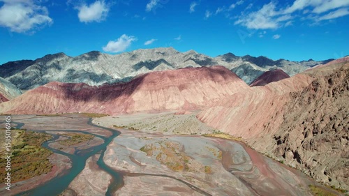 Drone view of Yadan landform near Kashgar in southern Xinjiang, China. High angle view of colorful mountains in sunny autumn day, 4k real time landscape footage b roll shot.