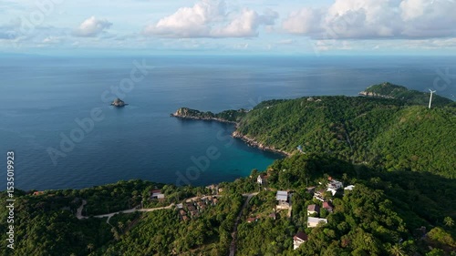 Aerial view of the island and cape from above looking towards the island and sea.