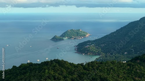 Aerial view of the island and cape from above looking towards the island and sea.