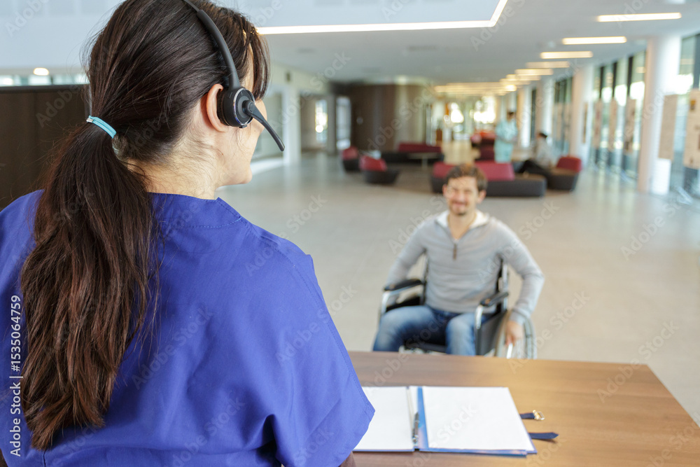 Obraz premium man in wheelchair in reception area