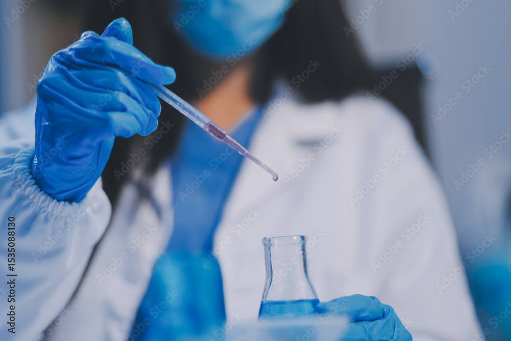 Fototapeta premium Research, experiment and medical trial being done by a scientist in a lab, science facility or hospital. One young, serious and professional researcher organizing, sorting or making a discovery