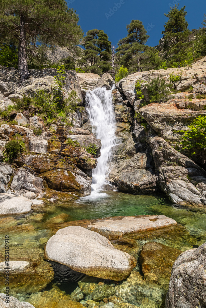 Water cascades over the Cascade des Anglais on the L'Agnone river through the forest and mountains of the GR20 trail at Vizzavona on the Mediterranean island of Corsica Water cascades over the Cascade des Anglais on the L'Agnone river through the forest and mountains of the GR20 trail at Vizzavona on the Mediterranean island of Corsica