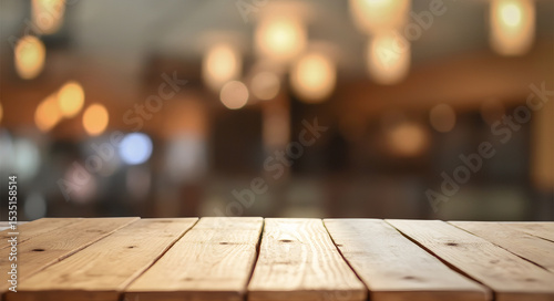 Rustic wood surface in front of cozy defocused evening ambiance.