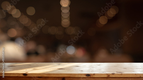 Empty wooden tabletop with warm light bokeh background, suitable for product mockup.