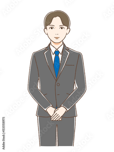 正面をむいて微笑むスーツの男性