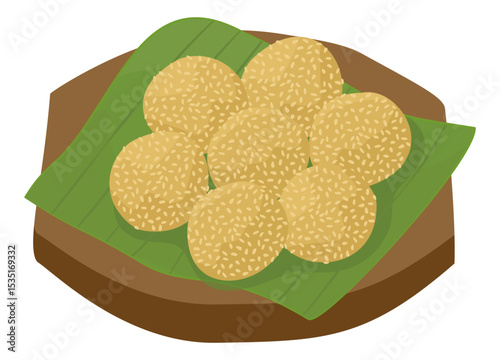 A set of onde onde, Indonesian traditional food, round sesame seed-covered glutinous rice balls, sits on a wooden board with banana leaves.