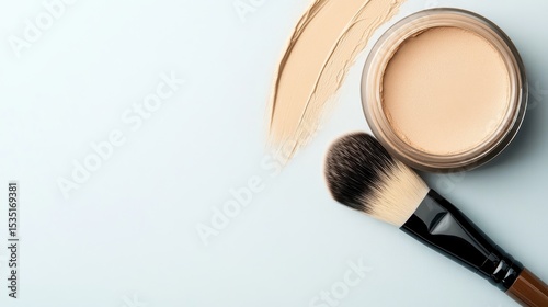 A chic arrangement of a natural beige makeup cream jar, accompanied by a soft bristle brush, exemplifying beauty essentials with a minimalist aesthetic.