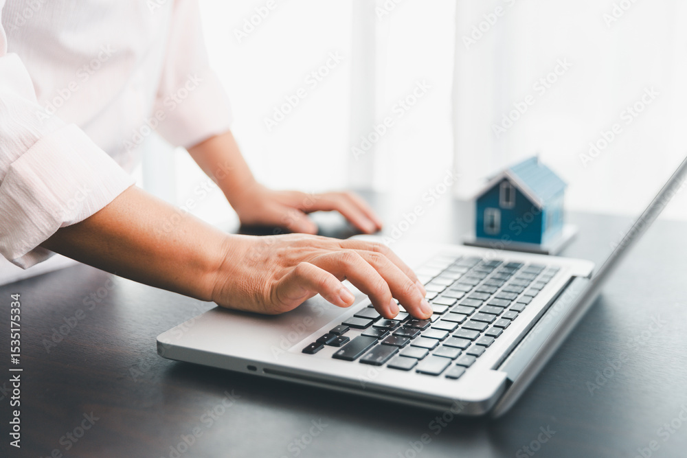 Calculator to check and summary expense of home loan mortgage for refinance plan , people lifestyle concept. Home agents are using calculator to calculate the loan period each month for customer.