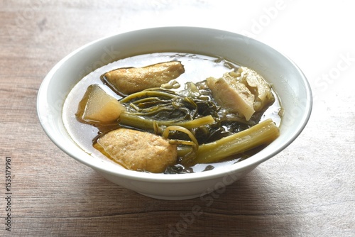 boiled braised mixed vegetable with tofu in Chinese herb stew soup on bowl 