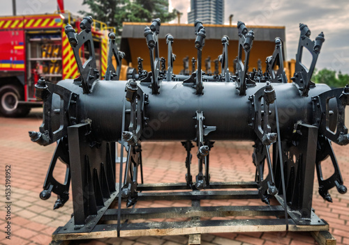 Demining machine rotor with spiked flails, designed for clearing landmines with durable engineering.