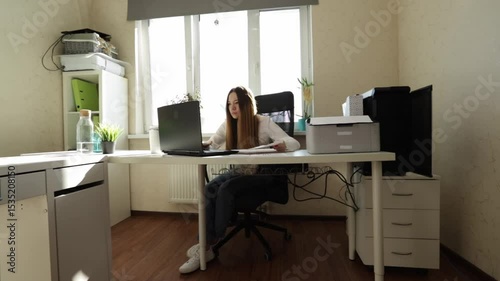 Productive Businesswoman Typing on Laptop at Minimalist Office Desk