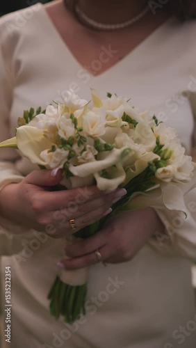 elegant bride holding a beautiful white bouquet