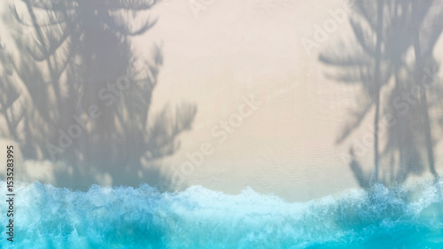 Abstract of the tropical beach with  blue Aqua waves and coconut palm leaf shadow on background.