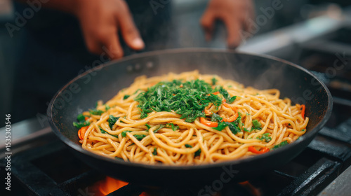 Stir fried noodle, vegetable, and herb dish cooking in hot pan, with steam rising and hands of person preparing food in kitchen setting, evoking sense of warmth and freshness