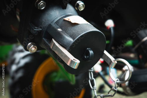 Cuadro en lienzo Agricultural trailer hitch with a metal safety pin attached by a chain, mounted on the rear of a vehicle