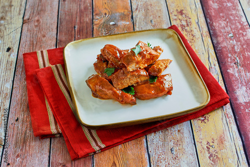 oven baked country style ribs in tossed with a spicy bbq sauce