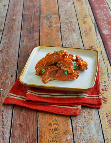 oven baked country style ribs in tossed with a spicy bbq sauce