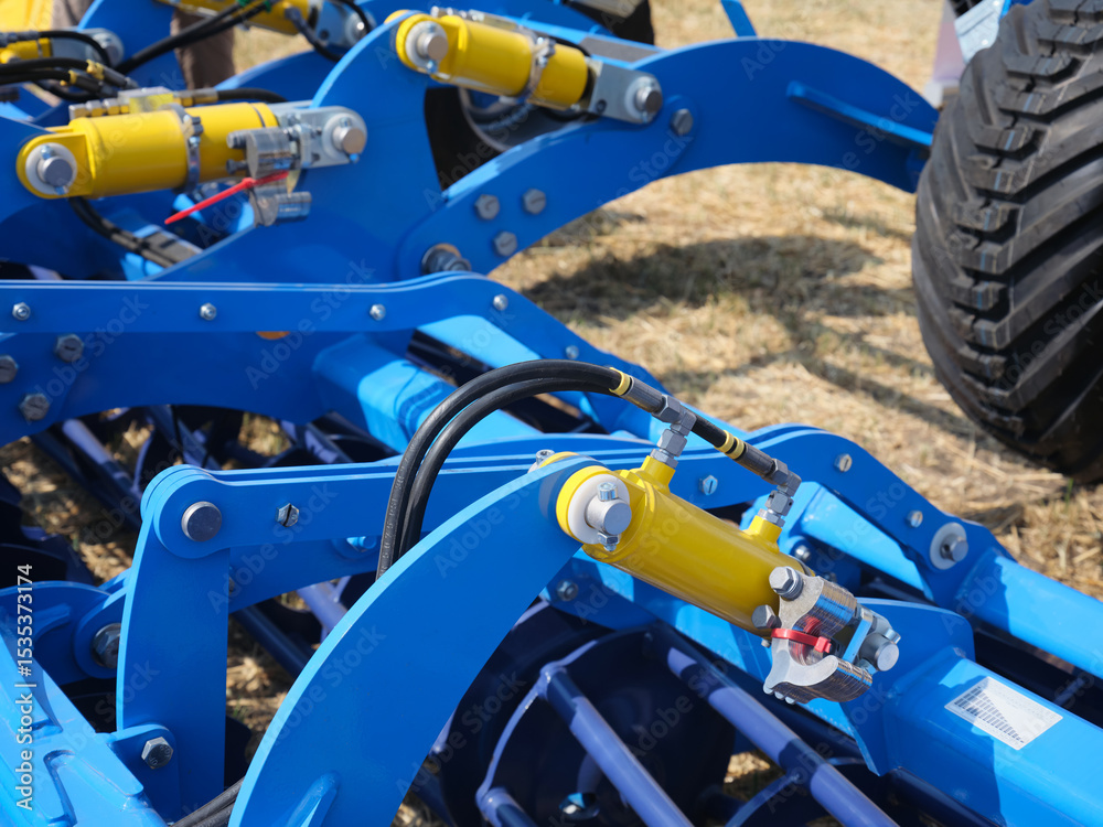 Fototapeta premium Close-up of hydraulic system of agricultural equipment machine. New models of agricultural equipment.