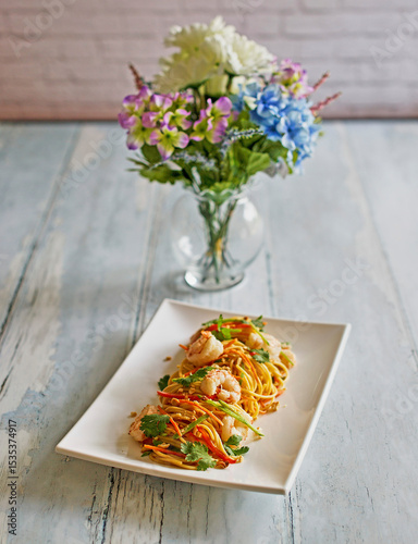 spicy Asian style noodles with shrimp in a peanut sauce