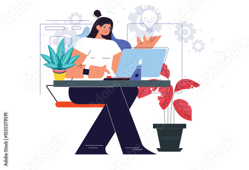 Businesswoman working on laptop at office desk