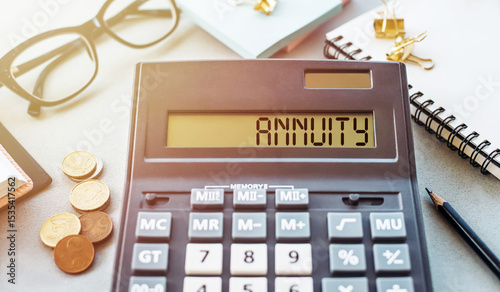 Calculator Displaying the Word Annuity on a Business Finance Desk