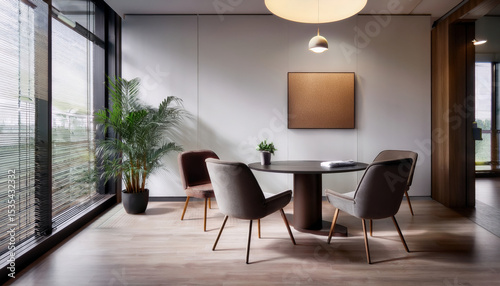 Modern consultation room featuring soft lighting, comfortable chairs, and round table, creating welcoming atmosphere for discussions
