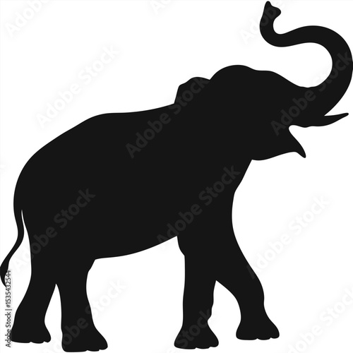 Silhouette of a majestic african elephant in a walking pose with its trunk upwards