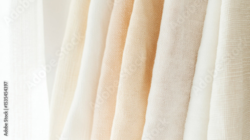 Light pastel clothes in soft textures create warm and inviting background