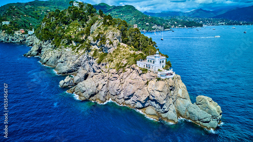Obraz na plátně Portofino, Italy – lighthouse on rugged cape, side perspective