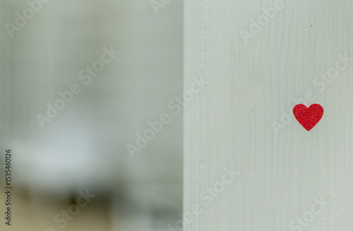 love and romance concept, heart on white wooden wall