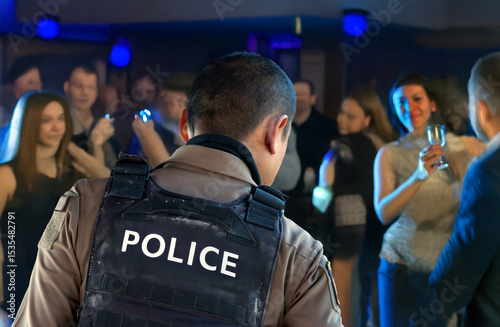 A police officer inspects a nightclub with guests enjoying social activities and entertainment.