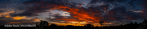panorama Sunlight with dramatic sky on dark background.Vivid sky on dark cloud.