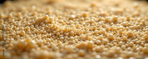 Close-up of Tapioca Pearls: A detailed close-up shot of countless tapioca pearls, showcasing their creamy beige color, smooth texture, and spherical shape.