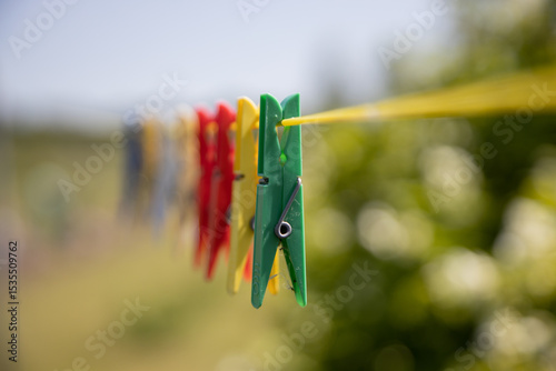 Close-Up of Colorful Clothespins on a Clothesline Outdoors