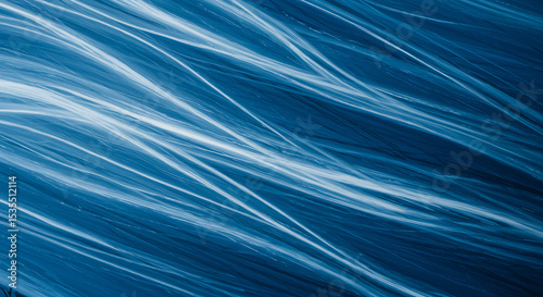 Abstract representation of wind using fluid blue and white streaks across canvas.