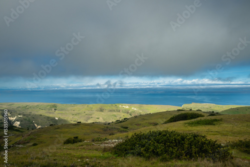 Green Foothills in front of Blue Pacific Ocean