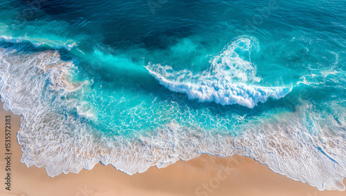 Aerial view of turquoise ocean waves crashing onto sandy beach shoreline, tropical paradise, vacation destinationGenerative ai