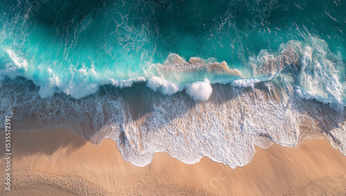 Aerial view of turquoise ocean waves crashing onto sandy beach shoreline, tropical paradise, vacation destinationGenerative ai